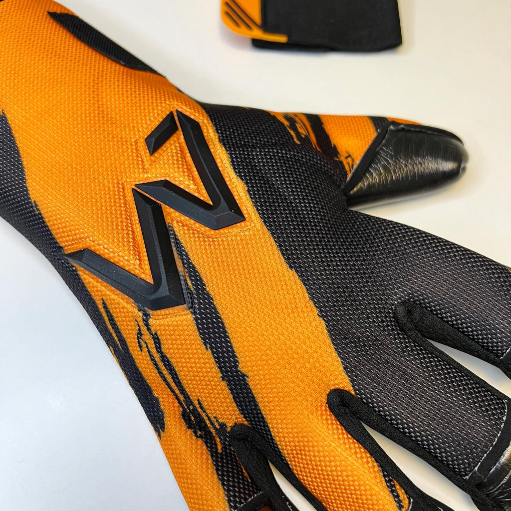 AM Ukkonen 1.0 goalkeeper gloves black orange AM logo backhand close-up – AM Gloves