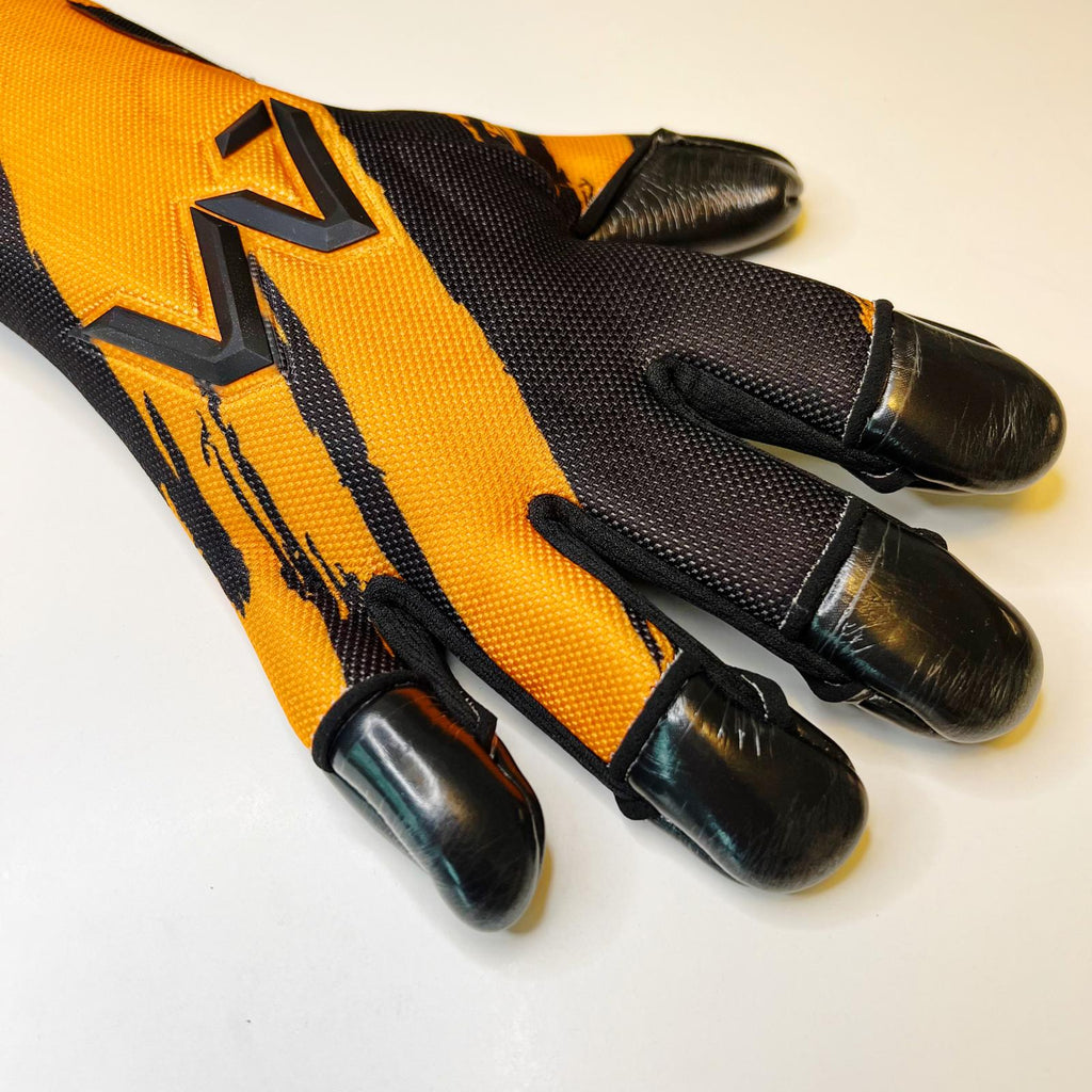 AM Ukkonen 1.0 goalkeeper gloves black orange fingertip latex and backhand finger detail – AM Gloves