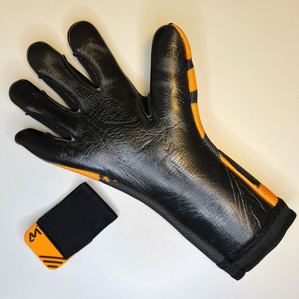 AM Ukkonen 1.0 goalkeeper gloves black orange palm latex and wrist strap detail – AM Gloves