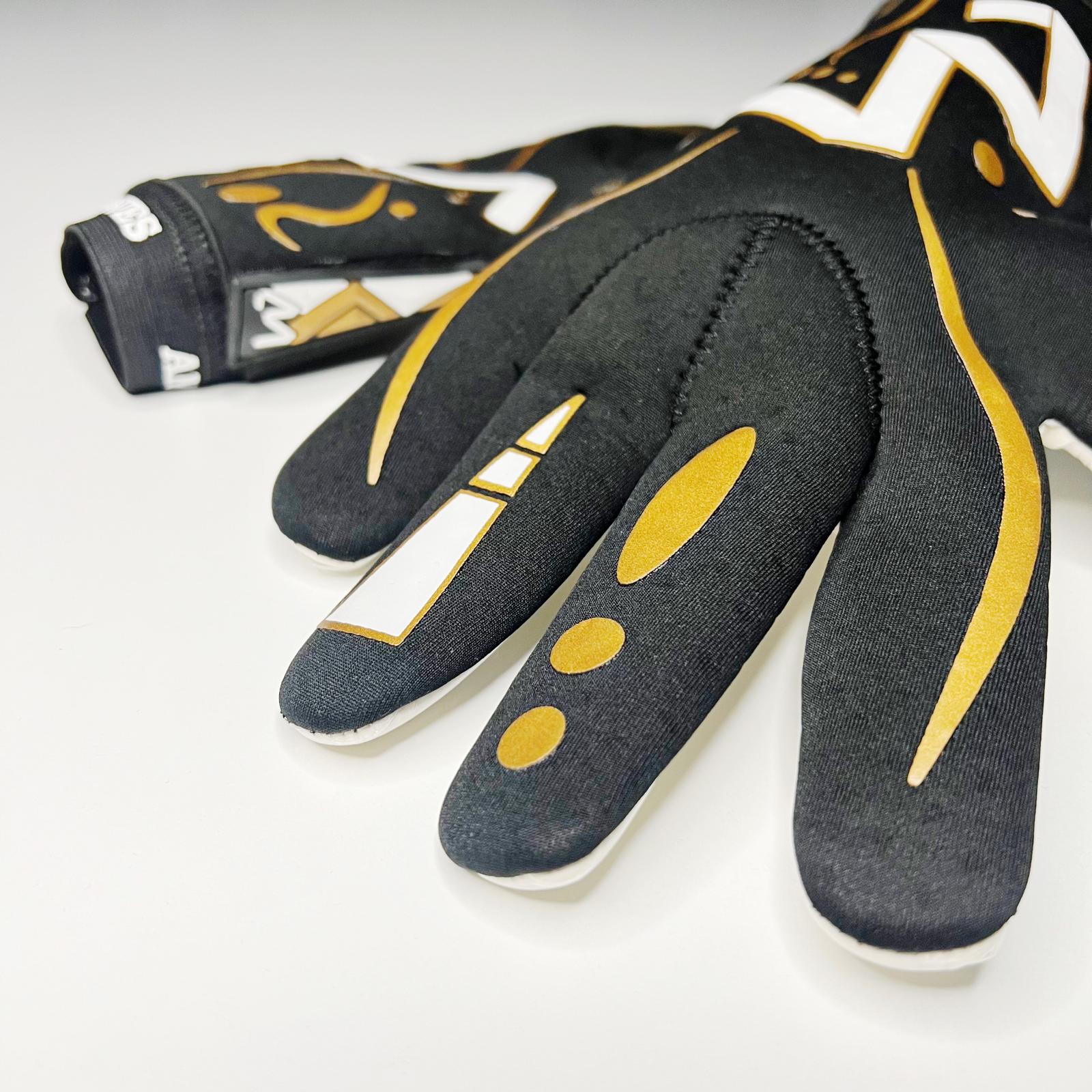 AM Nuoli Golden Edition goalkeeper gloves black gold finger detail and backhand close-up – AM Gloves