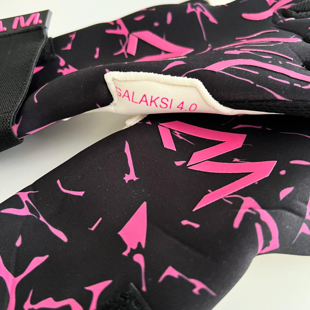 AM Galaksi 4.0 goalkeeper gloves black pink model label and wrist strap close-up – AM Gloves